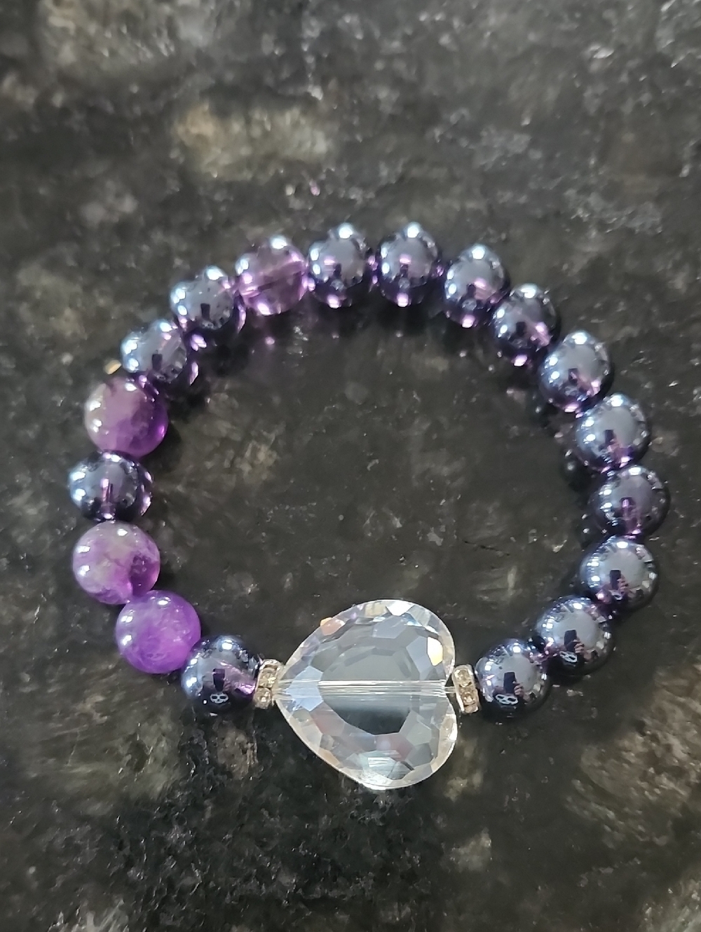 Handmade Shades Of Purple Glass Beaded Bracelet With Crystal Heart Centerpiece.